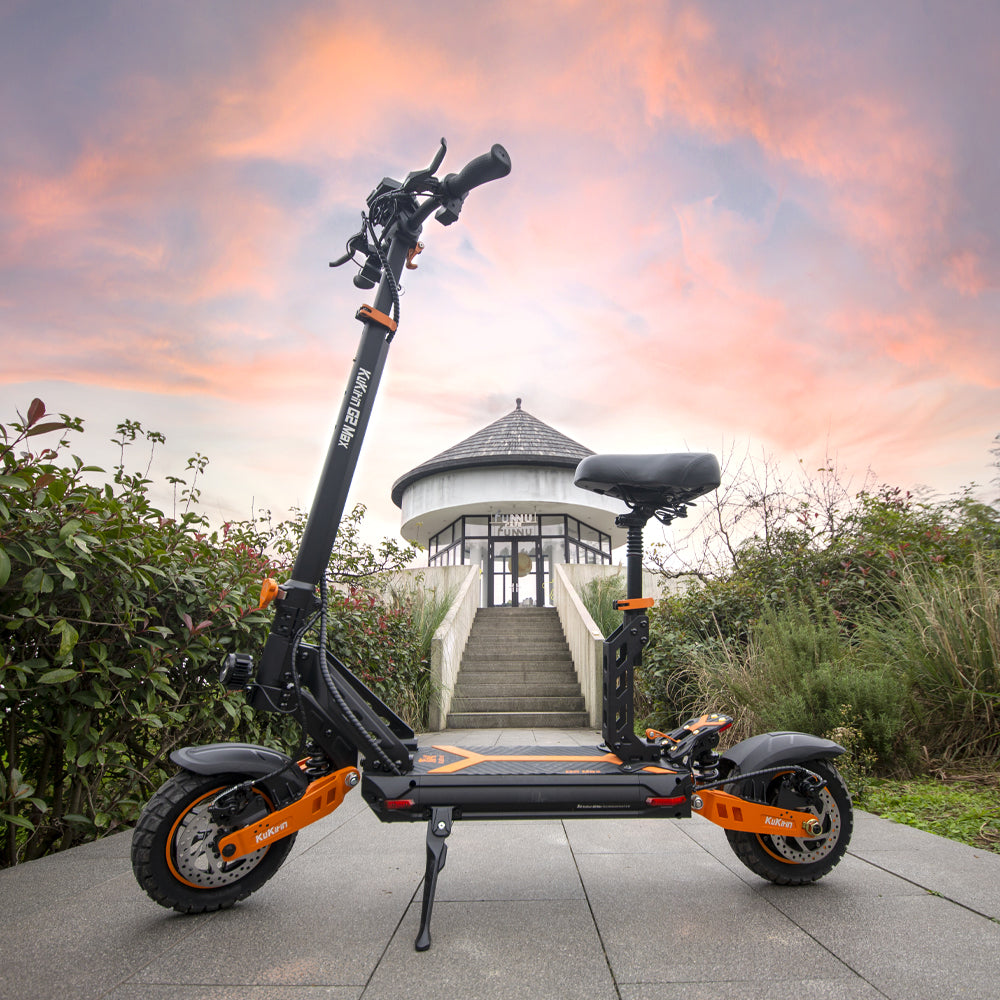 KuKirin G2 Max electric scooter with seat outdoors at sunset