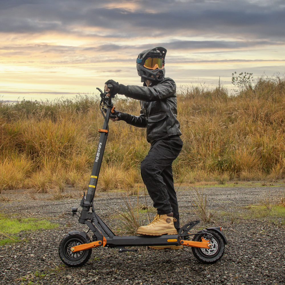 Rider using a KuKirin G2 Pro VMP electric scooter off road