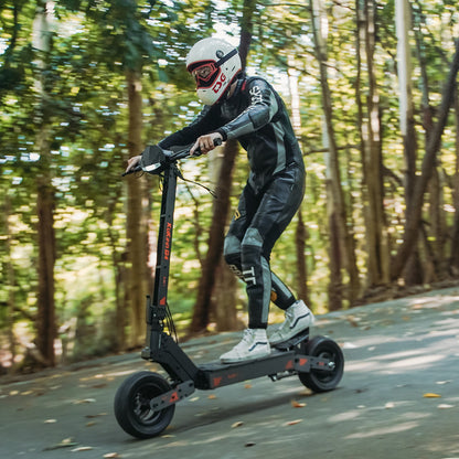 Helmeted rider using a KuKirin G4 electric scooter outdoors