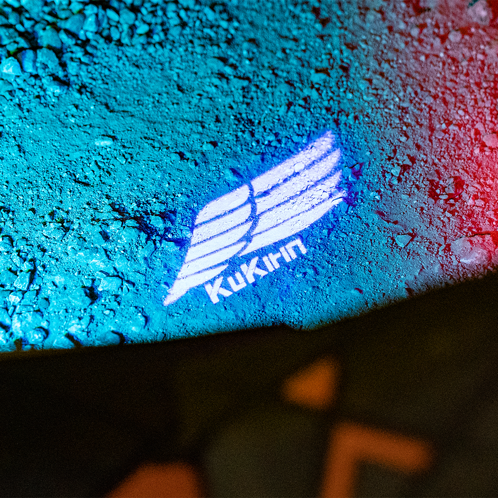 KuKirin T3 KuKirin logo light projected onto the ground