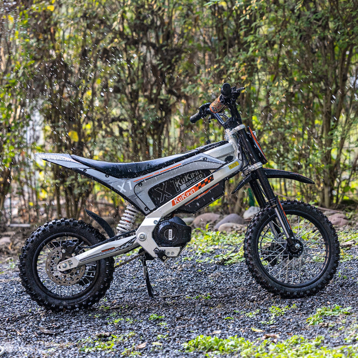 KuKirin X1 electric dirt bike on rough private terrain