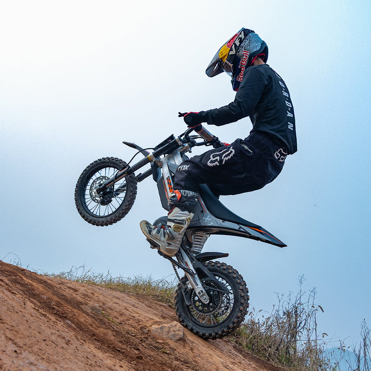 KuKirin X1 electric dirt bike climbing a dirt track